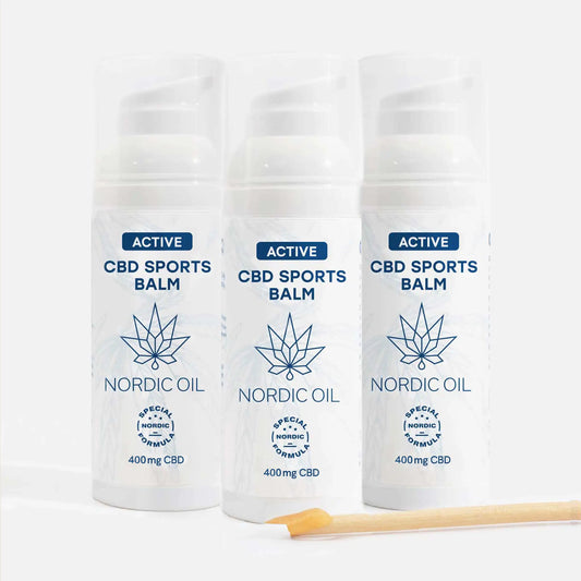Trois flacons spray de baume CBD sportif Nordic Oil, étiquettes blanches avec logo de feuille de cannabis et inscription 400 mg CBD