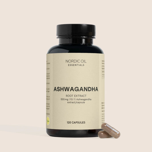 Bouteille noire de compléments Ashwagandha (extrait de racine) avec deux capsules à côté.
