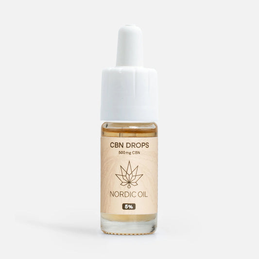 Flacon d'huile CBN avec compte-gouttes de Nordic Oil, étiquette beige ornée d'une feuille et indiquant 500 mg CBN